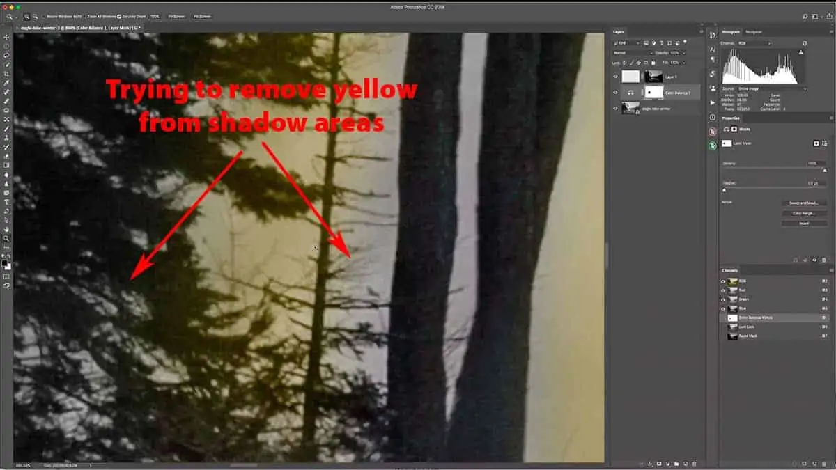 Removing a warming adjustment layer from shadows with the brush tool